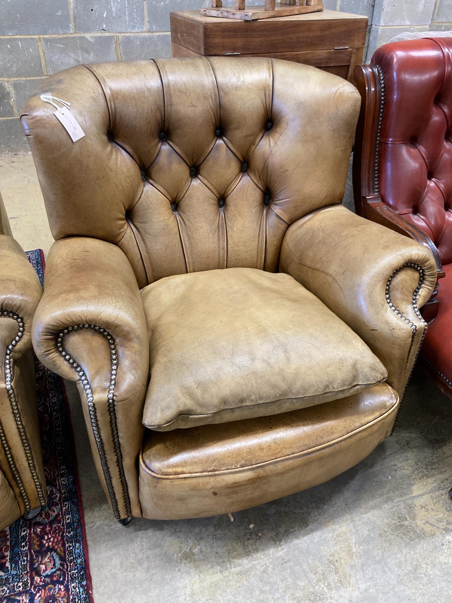 A three-seater Chesterfield leather settee, length 180cm, depth 100cm, height 84cm and a matching armchair